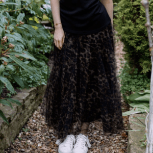 Women standing outside wearing a leopard print tulle skirt in chocolate brown with white trainers