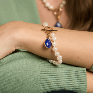 Clara white irregular cultured freshwater pearl bracelet with a lapis lazuli drop pendant