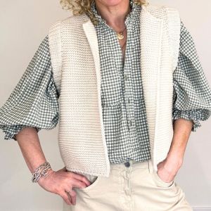 pretty gingham blouse with a knitted cream coloured gilet over the top
