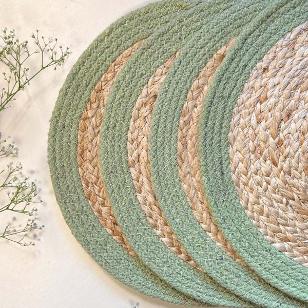 product shot of a set of four olive seagrass and jute placemats