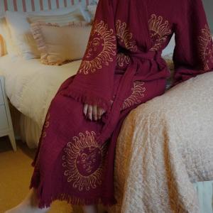 Make a statement with our limited-edition Merlot Burgundy Gold Sun Long Cotton Kimono Robe, exclusive to Loome Lifestyle. Handmade from 100% organic Turkish cotton, this lightweight yet luxurious kimono features our bestselling hand block-printed gold sun motif.