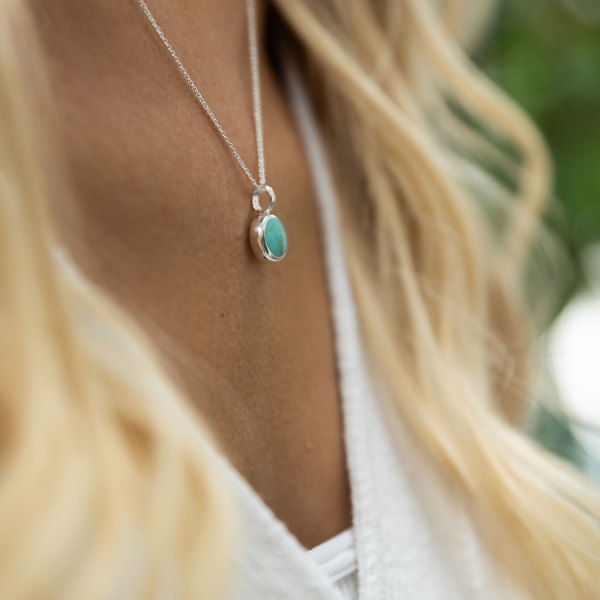 Turquoise and silver pendant necklace